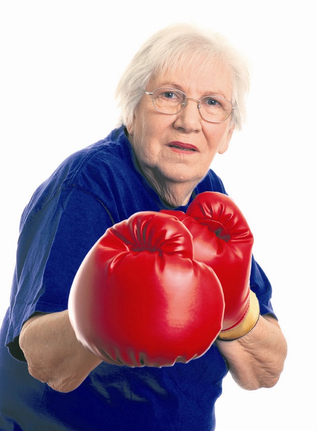 Isolated Senior woman boxing on a white background